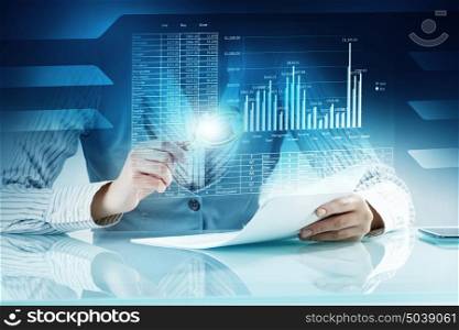 Analyzing statistics data. Close view of businesswoman working with papers at table