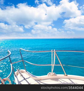 Anchor boat y tropical idyllic tropical turquoise beach under blue sky and clouds