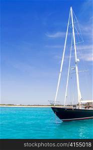 anchored sailboats in turquoise Formentera Illetes beach near Ibiza