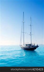 anchored sailboats in turquoise Formentera Illetes beach near Ibiza