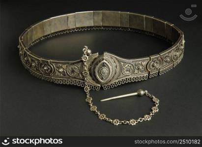 ancient antique belt on black background. Middle-Asian vintage jewelry. old Oriental ornaments