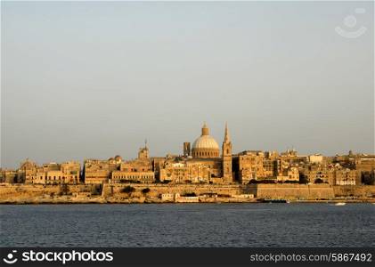ancient architecture of malta island at sunset