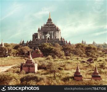 Ancient architecture of old Buddhist Temples at Bagan Kingdom, Myanmar (Burma). White Thatbyinnyu Temple is one of the biggest in Bagan. Travel landscapes and destinations in vintage style.
