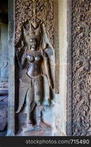 Ancient bas relief in The Angkor Wat Temple, Cambodia