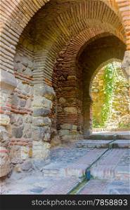 Ancient brick passageway door in the famous La Alcazaba in Malaga Spain