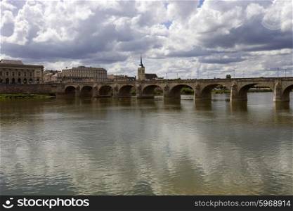 Ancient bridge of Saumur in Loire River, France