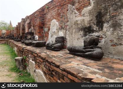 Ancient Buddha statue at Wat Yai Chaimongkol in the historical city, Ayutthaya, Thailand