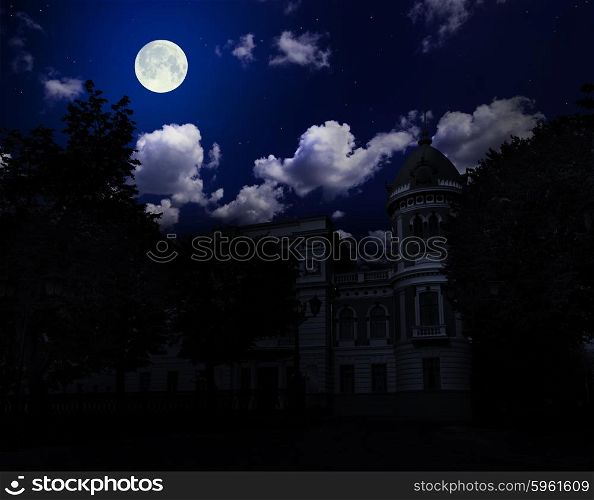 Ancient building under night sky with moon