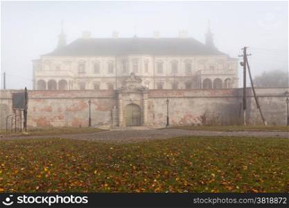 Ancient castle. Ancient castle in the morning fog. Autumn season
