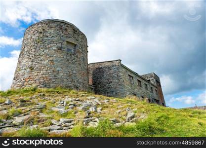 Ancient castle on the top of green mountain