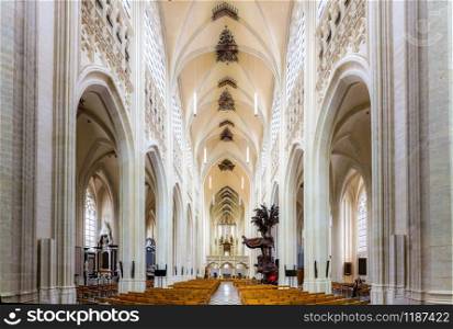 Ancient cathedral church hall with benches, old Europe. Traditional european architecture, famous places for tourism and travel, religion