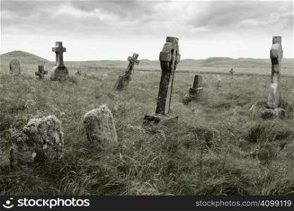 Ancient Celtic gravesite with unmarked gravestones from the 1600&acute;s in the middle of a meadow in rural Scotland.