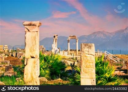 Ancient city of Hierapolis and a statue of Pluto or Hades at dawn. UNESCO cultural heritage. Pamukkale, Denizli, Turkey. Ancient city of Hierapolis and a statue of Pluto or Hades at dawn