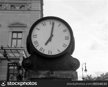 Ancient clock in Berlin in black and white. An ancient street clock in Berlin, Germany in black and white
