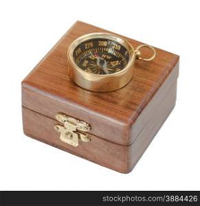 Ancient compass on a wooden case isolated on white background