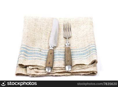 Ancient cutlery on linen