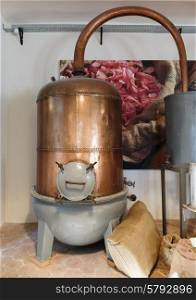 Ancient distiller for the production of perfume in Fragonard factory in Grasse, France