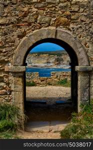 Ancient door leaving to a wonderful landscape