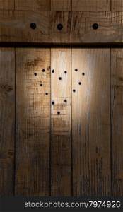 Ancient draw of heart on a door made of wood. Chalet in north Italy.