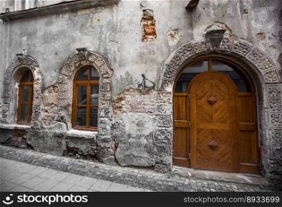 ancient facade of the house, old doors and windows