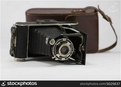 Ancient Folding Camera with Bellows and Brown Leather Case.. Ancient Folding Camera with Bellows and Brown Leather Case