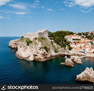 Ancient fortress on the cliff edge of Dubrovnik protects the port