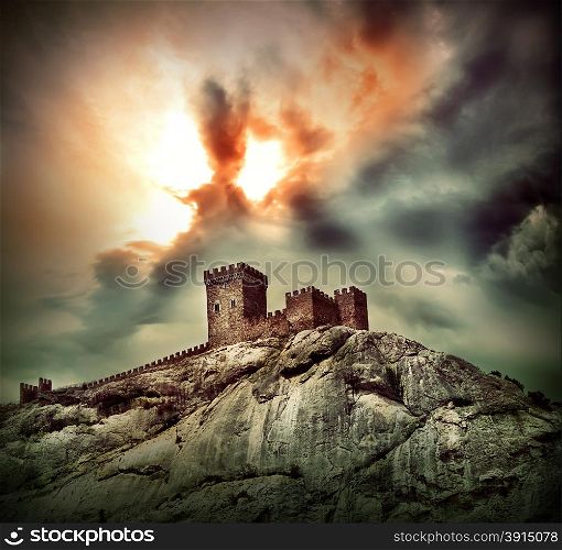 Ancient fortress on the hill under dramatic sky