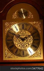 ancient golden wall clock closeup