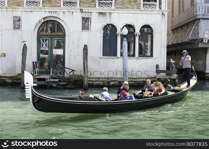 Ancient gondolas boat in Venice. Gondolier on black gondola