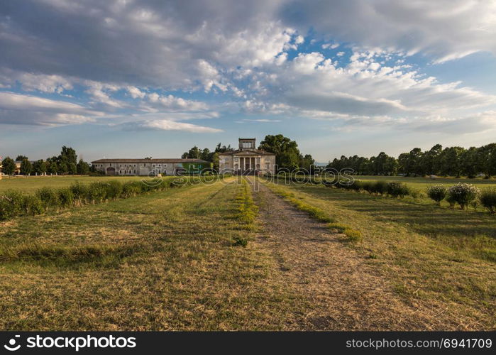 Ancient Italian Neoclassical House inside Park and Blue Sky with Clouds.. Ancient Italian Neoclassical House inside Park and Blue Sky with Clouds