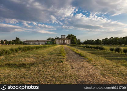 Ancient Italian Neoclassical House inside Park and Blue Sky with Clouds.. Ancient Italian Neoclassical House inside Park and Blue Sky with Clouds