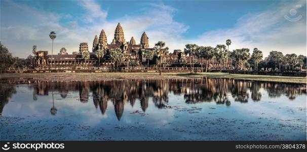 Ancient Khmer architecture. Amazing view of Angkor Thom temple under blue sky. Angkor Wat complex, Siem Reap, Cambodia travel destinations. Six vertical images panorama