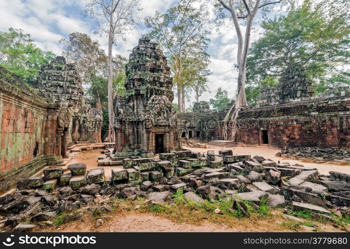 Ancient Khmer architecture. Panorama view of Ta Prohm temple with giant banyan trees at Angkor Wat complex, Siem Reap, Cambodia