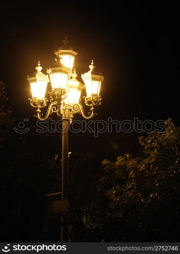 Ancient lantern. A night photo, light from street lanterns