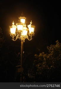 Ancient lantern. A night photo, light from street lanterns