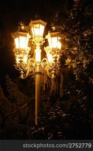 Ancient lantern. A night photo, light from street lanterns