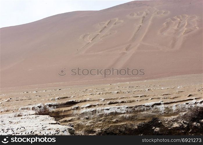Ancient large-scale geoglyph Candelabrum figure in Paracas national park