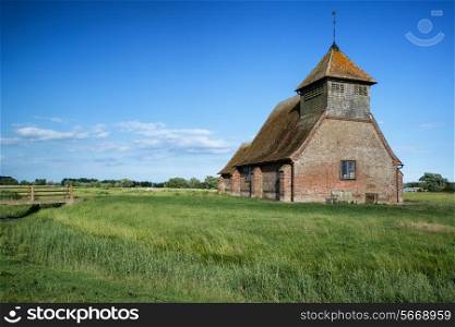Ancient Medieval church landscape against Summer sky