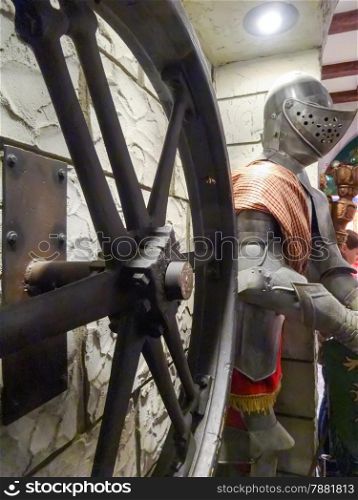 ancient medieval collection of wheel and knight shield costume at museum