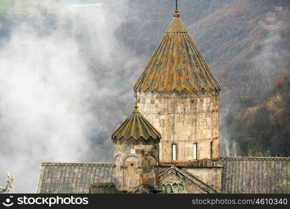 Ancient monastery Tatev covered with clouds in the mountains of Armenia. Was founded in year 906.