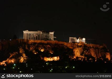 Ancient monument lit up at night in Athens, Greece