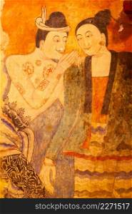 Ancient murals painting of man whispering to woman, famous mural painting at Wat Phumin, a famous buddhist temple in Nan Province, Thailand. The temple is open to the Public.