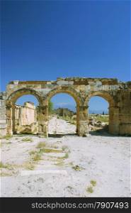 Ancient road and arch Pamukkale, Turkey, Pamukkale, Hierapolis Turkey.