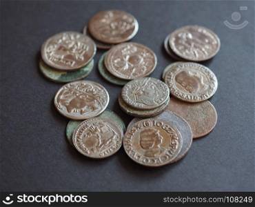 Ancient Roman coins. Ancient Roman and medieval coins over black background