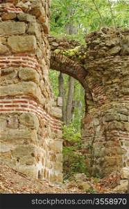 Ancient roman fortress ruins, arch, wall, forest