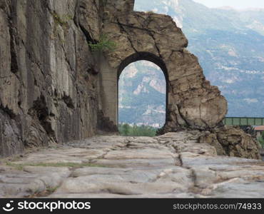 Ancient roman road arch in Donnas. Ancient roman consular road stone arch in Donnas, Italy