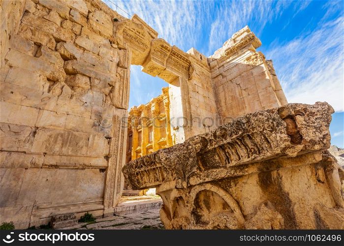 Ancient Roman temple of Bacchus and remain of one of its pillar with blue sky in the background, Bekaa Valley, Baalbek, Lebanon