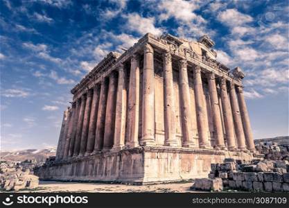 Ancient Roman temple of Bacchus with surrounding ruins and blue sky in the background, Bekaa Valley, Baalbek, Lebanon