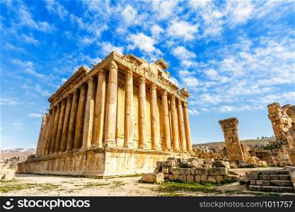 Ancient Roman temple of Bacchus with surrounding ruins with blue sky in the background, Bekaa Valley, Baalbek, Lebanon