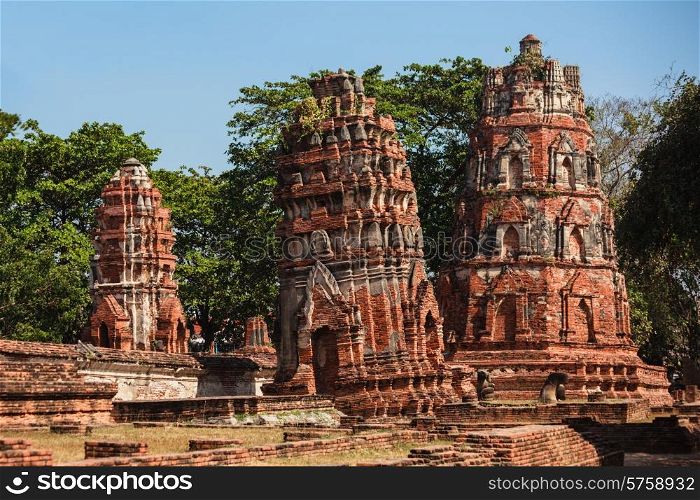 Ancient ruins of Buddhist temples at Wat Mahathat in Thailand